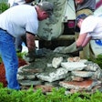 Bob Harris and son Robby Harris reuse concrete test slabs to create a foundation for a one-of-a-kind boulder.