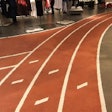 A custom made, 7,000-lineal-foot-long adhesive running track stencil was used on the surface. Once the stencil was down and the surrounding areas masked off, the track was splattered down the SYPP Red colorant in THIN-FINISH in two coats.