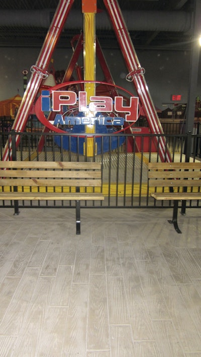 Decorative concrete mimics a wood boardwalk at iPlay America indoor theme park in New Jersey.