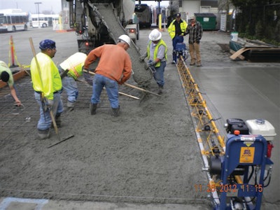 Speed Screed Cruiser, used in paving Sonoma County bus yard, includes extensions that allow variable paving widths and crown variations.