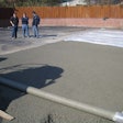 Finishing the pervious concrete was done with roller-screed strike-off, covered with plastic and rolled, and then received a plastic cover cure.