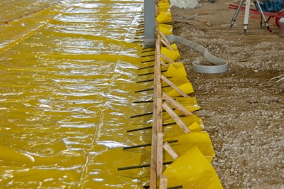 Most floor slabs require vapor retarders under them now. They prevent ground moisture from moving through the slab, but they also act as a slip-sheet allowing large floor areas to contract without activating joints.