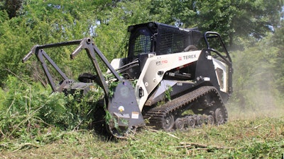 Surgical Land Clearing uses a 111-hp Terex PT-110 Forestry compact track loader with a Loftness brush cutter attachment to cut through undergrowth and trees up to 8 in. in diameter.
