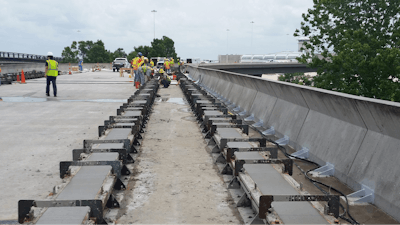Poured section with forms in place prior to gang-stripping.