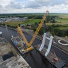 It took just short of four hours to lift the west side bridge segment to height and another two hours for moving the crane barges and load into installation position. Within a final three hours, Sarens’ crew attached the pivoting segment of the bridge to complete the first lift. The entire process was completed in one long day.