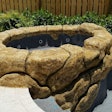 The rock waterfall pictured here was created using a concrete squeeze pump, which was the ideal solution for Pool Crafters to preserve the detailed process of rock carving.