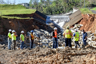 Spillway completely damaged. Thompson’s staff first day on the job evaluating the upcoming project.