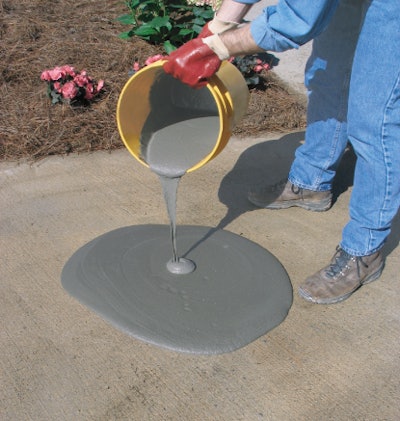 Pour the resurfacer onto the concrete in one-foot wide strips and scrub the material around the surface with a long-handled squeegee. Use sufficient pressure to work the material into the surface pores and build to a nominal 1/8” thickness.