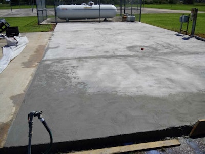 One of Thomas Werline's most recent projects was to renew an uneven, heavily soiled and unattractive concrete deck utilized for a large waste container holding area at a Central Florida school.
