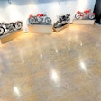 Layers of paint, epoxy, carpeting, luxury vinyl tile and vinyl composite tile once covered the floor at the Moto Museum in St. Louis, which houses some of the rarest motorcycles in the existence.