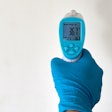 Person Wearing A Rubber Glove 4021186