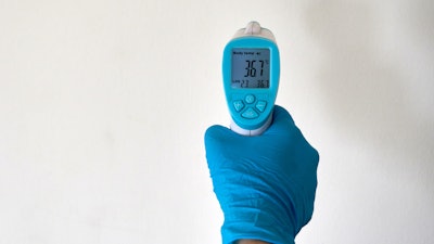 Person Wearing A Rubber Glove 4021186