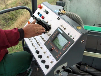 Paver control systems have come a long way over the past decade. Shown is a past generation operating concept on a Vogele asphalt paver.