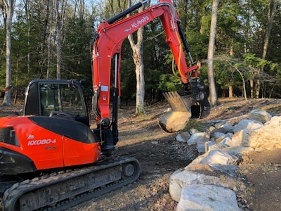 Marlboro Mountain Construction is uses a Werk-Brau Power Grip Bucket and Engcon Tiltrotator to easily grip and move rock and other materials.