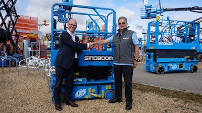 The partnership was signed by Tim Whiteman, CEO of Sinoboom BV, right, and Kristof Bolle, senior VP EMEA for TVH, left.
