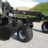 Designed for use by asphalt, landscaping, and concrete flatwork contractors, the machine has an 8-ft., six-way hydraulically controlled moldboard operated by an in-cab remote.