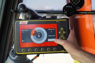 This system alerts the operator of a potential collision with a worker on the ground.