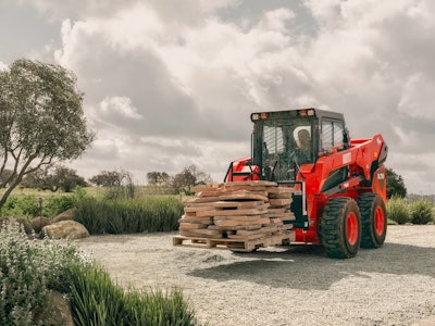 KIOTI’s SL750 helps operators easily dump materials into trucks and high-sided hoppers.