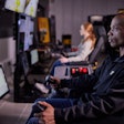 Remote control is also used when performing grading operations under Stage 3 conditions. In this instance, the operator is not on board the vehicle but operating it from a separate location using a joystick or belly box.