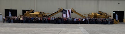 The company’s employees gathered for a group photo at the event.