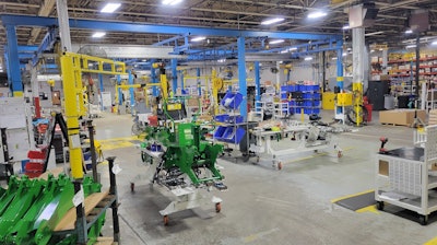 Amerequip's backhoe assembly area in the fall of 2023. Shows the 'right sizing' efforts to reduce inventory in the cell to only what is needed and focusing specifically on the operator's ability to fulfill their job responsibilities without needing to search for necessary parts and tools.