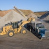 Weighing assistance on wheel loaders takes some of the guesswork out of loading. Using a wheel loader to fill a truck is made much easier by getting exact weights in each scoop.