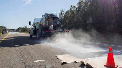 A truck applies Delta Mist being to the NCAT test track. The treated pavement continued to outperform the control surface even 48 months after the initial application.