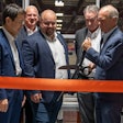 Toyota Material Handling held a ribbon-cutting ceremony for the company’s AutoStore installation within its Parts Distribution Center in Columbus, Indiana. Pictured (Front L-R): Bastian Solutions Chairman Hito Matsuoka, AutoStore Director of Sales - North America Joe Elie, and Toyota Material Handling North America President & CEO Brett Wood (Back L-R): Toyota Material Handling Vice President of Aftermarket Operations Bret Bruin and Toyota Material Handling President & CEO Bill Finerty.