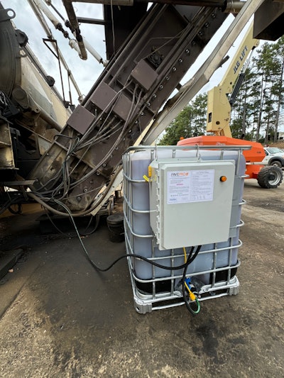 Storage tank connected to automated plant application sprayers.
