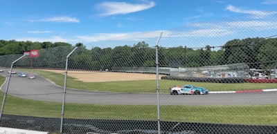 The MotorSports In Action, Pothole Heroes branded McLaren outpacing the competition at Mid Ohio Sports Track.
