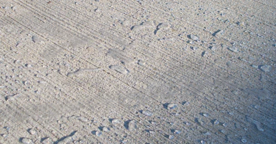 Penetrating concrete sealers repel water while allowing vapor to escape.