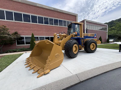 During the event, the company also unveiled the 'Ochi Loader,' (pictured here) a restored WA450-1 wheel loader from 1988 named after the facility's first Japanese general manager, Shohei Ochi.