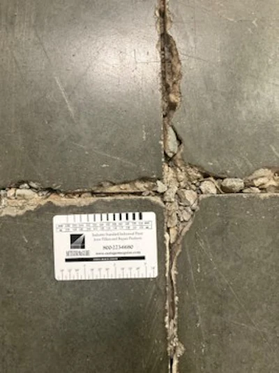 Figure 3. Joint spalling due to the impact of small, hard wheels when there is high differential deflection of the joint (e.g., no dowels).