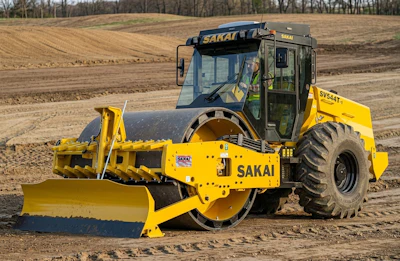 The pictured SV544-1 variant is a padfoot model (SV544T-1) with the following factory-installed optional equipment: bolt-through design smooth shell kit, enclosed cab, and hydraulic leveling blade.