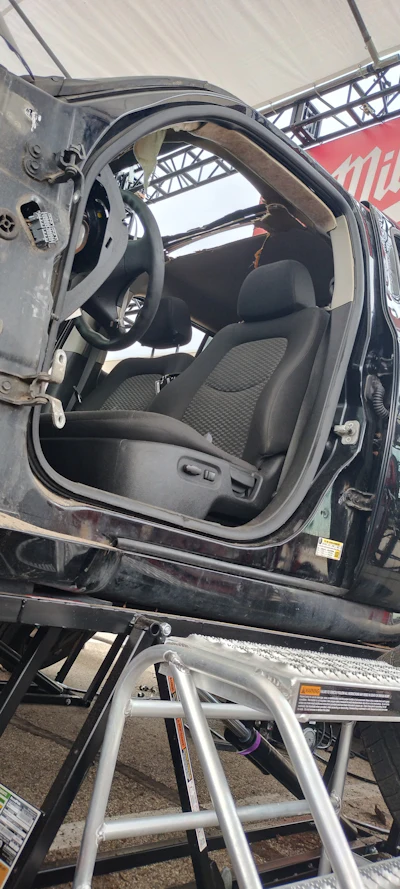 This was a fairly normal looking SUV at the beginning of the day. It had a door and full roof.