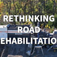 Road rehabilitation equipment with asphalt paving machinery in forest setting, promoting rethinking road rehabilitation