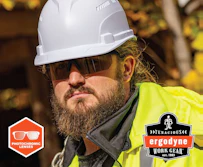 Construction worker wearing white hard hat, dark sunglasses, and neon yellow safety vest with Ergodyne branding