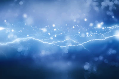 Blue abstract background with glowing lightning bolts and bokeh light particles