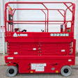 Red LGMG S3232E electric scissor lift with safety railings and control panel displayed against white garage door
