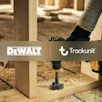 Construction worker using DeWALT drill on wooden frame with Trackunit branding overlay